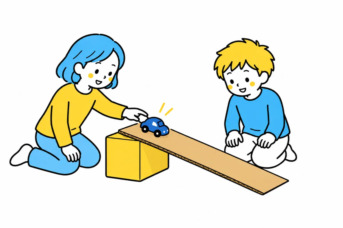 低い坂でおもちゃの車を転がし、動きに興味を持つ二人の子ども