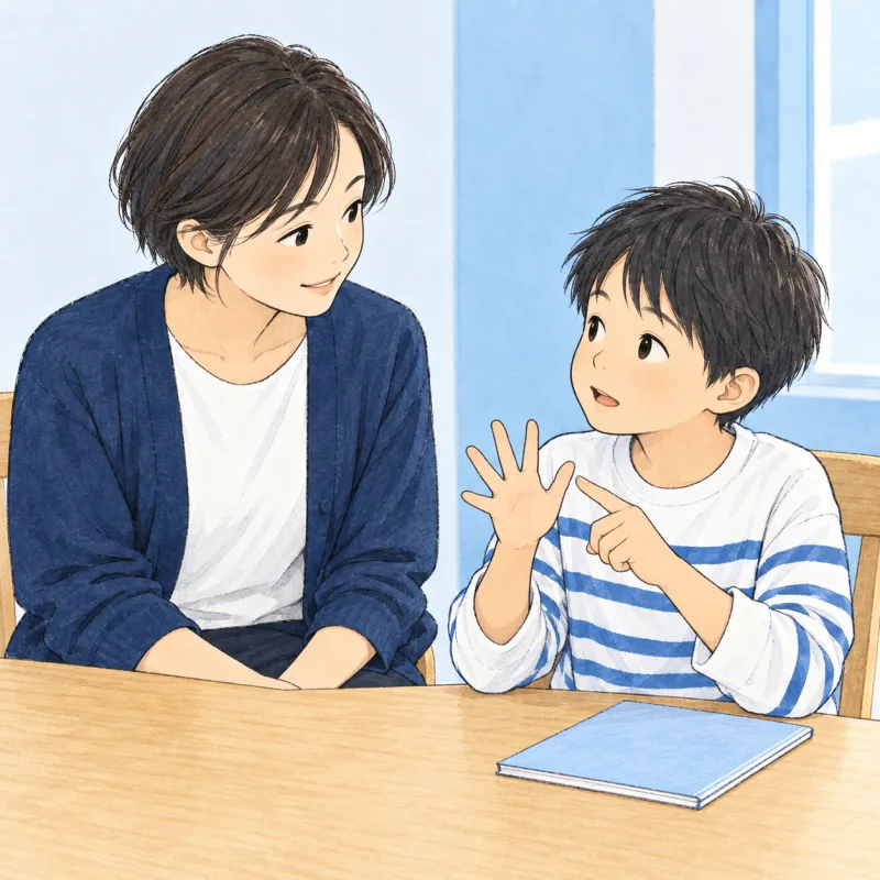 子どもが伝えようとしていることを、そばで落ち着いて聞く大人のイメージ